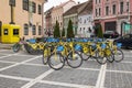 Rent of city bicycles in the Square of Council Market in the Old Town of Brasov in Romania Royalty Free Stock Photo