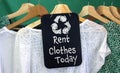 Rent Clothes today sign and recycle clothes icon on chalk board with hanging clothes to rent Royalty Free Stock Photo