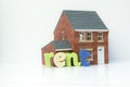 Rent lease house concept with model house and letters Royalty Free Stock Photo