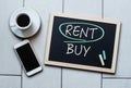 Rent not Buy blackboard concept. Choosing buying over renting.