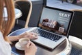 Rent online concept, woman using internet website for rental apartments Royalty Free Stock Photo