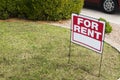 For rent sign with homes in background Royalty Free Stock Photo