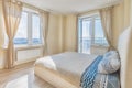 Rental apartment empty bright bedroom with two windows Royalty Free Stock Photo