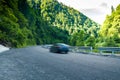 Rental car moving fast on the autobahn with beautiful nature autumn landscape. Adventure travel concept Royalty Free Stock Photo
