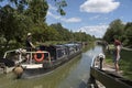 Rental narrowboat passing through a lock. England UK Royalty Free Stock Photo