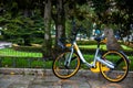 Rental public bike parked on a rainy day