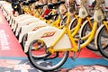 Rental service, public transportation concept. Street share bicycles or e-bikes for rent with electronic form of payment