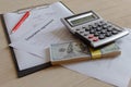 Renters insurance policy. Car insurance form with pen and calculator on the table Royalty Free Stock Photo