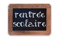 Rentree scolaire meaning Back to school written on a vintage blackboard with wooden frame isolated on white