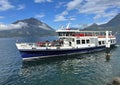 The Renzo, a Motonave serie Promessi Sposi ship departing Varenna on Lake Como with a load of passengers Royalty Free Stock Photo