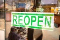 Reopen Signage board in front of Businesses or store door after covid-19 or coronavirus crisis- Concept of back to Royalty Free Stock Photo