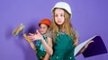 Repaint walls. Move in new apartment. Children sisters run renovation their room. Control renovation process. Sisters Royalty Free Stock Photo