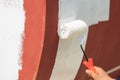 Repainting shell by roller brush