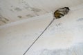 Repair in the apartment. Replacing electrics. Hole in the concrete wall for the wire. Work done with a Rotary Hammer Royalty Free Stock Photo