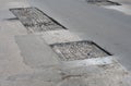 Repair asphalt road pavement hole and laying new asphalt patching method. Street road repair Royalty Free Stock Photo