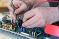 Repair of audio and video equipment. Fault diagnosis of the home theater Royalty Free Stock Photo