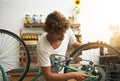 Repair, bicycle and man in a workshop, happy and prepare for training, exercise and competition. Male biker, person and