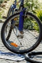 Repair of bicycle, prepare to change old tyre with tools Royalty Free Stock Photo