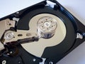 Repair broken computer part, close up of open hard disc drive hdd with platters, spindle, actuator and read/write head isolated Royalty Free Stock Photo