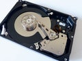 Repair broken computer part, close up of open hard disc drive hdd with platters, spindle, actuator and read/write head isolated Royalty Free Stock Photo