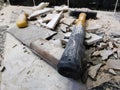 Repair - building with tools hammer, sledgehammer, cleaver and a knife with shards of tile