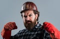 Repair and building. work gloves. serious male worker wear hard hat. brutal builder in helmet. bearded repairman
