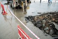 Repair of communications located under the carriageway. Road repair car breaks asphalt Royalty Free Stock Photo