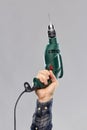 Close up of builder`s hand holding drill Royalty Free Stock Photo