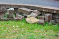 Repair damaged lawn guards. building blocks, bricks and a fragment of a decorative wall, fencing