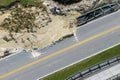 Repair of destroyed bridge after hurricane flood in Florida. Reconstruction of damaged road after flooding water washed Royalty Free Stock Photo