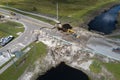 Repair of destroyed bridge after hurricane flood in Florida. Reconstruction of damaged road after flooding water washed Royalty Free Stock Photo