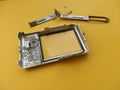 Repair and disassembly of a pocket digital camera Royalty Free Stock Photo