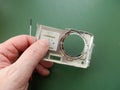 Repair and disassembly of a pocket digital camera Royalty Free Stock Photo