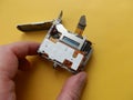 Repair and disassembly of a pocket digital camera Royalty Free Stock Photo