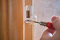 Repair door lock concept by a house worker Royalty Free Stock Photo