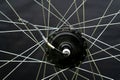 Repair of electric bicycles. Bicycle wheel, spokes and electric motor close-up on a black background Royalty Free Stock Photo