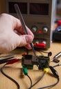Repair electronic circuit board manually tweezers Royalty Free Stock Photo