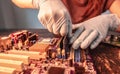 A repair engineer holds a RAM chip with his hands, inserts the RAM into the socket of the computer`s motherboard Royalty Free Stock Photo