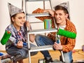 Repair family by happy couple building home using ladder. Royalty Free Stock Photo