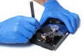 Repair Hard disk. Hands of master in gloves with screwdriver repair the computer hard drive