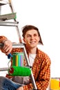 Repair home man holding paint roller for wallpaper. Royalty Free Stock Photo