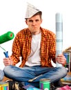 Repair home man holding paint roller for wallpaper. Royalty Free Stock Photo