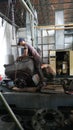 Workers repair of industrial machinery that is experiencing severe damage. Repair of compressor engines.
