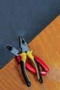 Repair industry tools lie on the edge of the table. background industrial set pliers hand tools