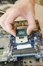 Repair laptops, close-up of hands and dismantled old computer