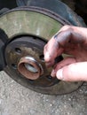 Repair or maintenance of car brakes, car mechanic, replacement of brake disc and brake pads