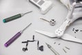 Repair maintenance drone, screws, screwdrivers, battery clamps