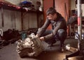 Repair man fixing car in repair station
