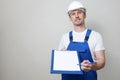 Repair man holding paper clipboard document Royalty Free Stock Photo