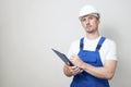 Repair man holding paper clipboard document Royalty Free Stock Photo